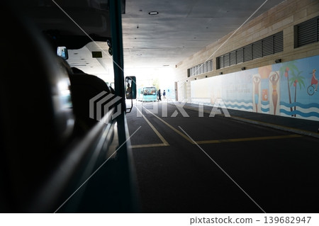 Bus Through Tunnel with Beach Mural on Sidewalk Bus Through Tunnel with Beach Mural on Sidewalk 139682947