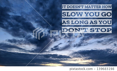An encouraging quote, It doesn't matter how slow you go as long as you don't stop, set against a dramatic, cloudy sky, emphasizing persistence and determination. An encouraging quote, It doesn't matter how slow you go as long as you don't stop, set against a dramatic, cloudy sky, emphasizing persistence and determination. 139683198