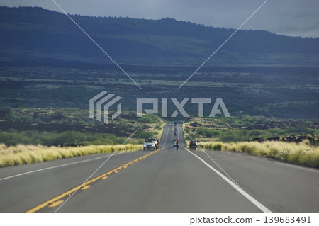 A single highway cutting through the lava plateau of the Big Island of Hawaii 139683491
