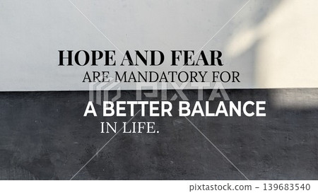 A philosophical quote about the necessity of hope and fear for life's balance, presented on a two-toned background of light gray and dark gray. A philosophical quote about the necessity of hope and fear for life's balance, presented on a two-toned background of light gray and dark gray. 139683540