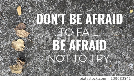 A powerful motivational quote about overcoming fear of failure, DON'T BE AFRAID TO FAIL. BE AFRAID NOT TO TRY., is overlaid on a textured gray background with scattered dry leaves. A powerful motivational quote about overcoming fear of failure, DON'T BE AFRAID TO FAIL. BE AFRAID NOT TO TRY., is overlaid on a textured gray background with scattered dry leaves. 139683541