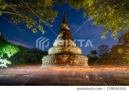 crowd around old stupa with full moon on buddhist Bucha Day at Wat Umong Suan Puthatham temple crowd around old stupa with full moon on buddhist Bucha Day at Wat Umong Suan Puthatham temple 139684368
