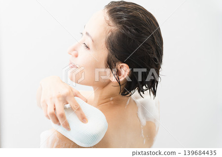 Woman washing her body beauty image Woman washing her body beauty image 139684435
