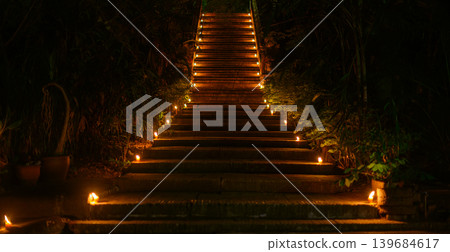 candles decorated on stairway to wat Umong temple at Buddhist day at night candles decorated on stairway to wat Umong temple at Buddhist day at night 139684617