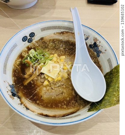 Soy sauce ramen topped with a large slice of char siu pork. Soy sauce ramen topped with a large slice of char siu pork. 139685102