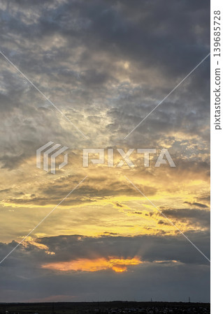 Vertical Sunset Sky With Glowing Storm Clouds Vertical Sunset Sky With Glowing Storm Clouds 139685728