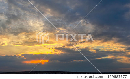 Dramatic Sunset Sky With Dark Storm Clouds Dramatic Sunset Sky With Dark Storm Clouds 139685777