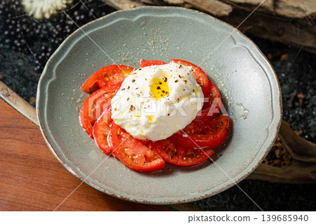 Tomato and ricotta cheese salad: A colorful Italian appetizer. Tomato and ricotta cheese salad: A colorful Italian appetizer. 139685940