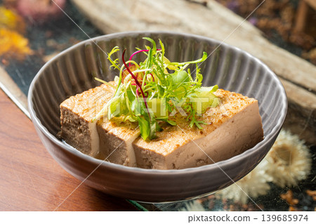 Oden tofu soaked in broth - a popular Japanese dish. 139685974