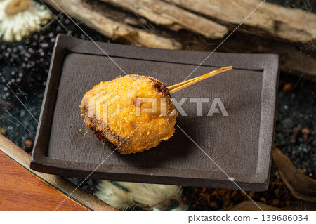Menchi katsu: A popular fried dish with a crispy texture and overflowing with juicy meat. Menchi katsu: A popular fried dish with a crispy texture and overflowing with juicy meat. 139686034