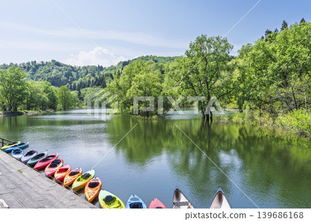 Lake Shirakawa in lush greenery and submerged forest; canoeing and the lake surface; Iide Town, Yamagata Prefecture Lake Shirakawa in lush greenery and submerged forest; canoeing and the lake surface; Iide Town, Yamagata Prefecture 139686168