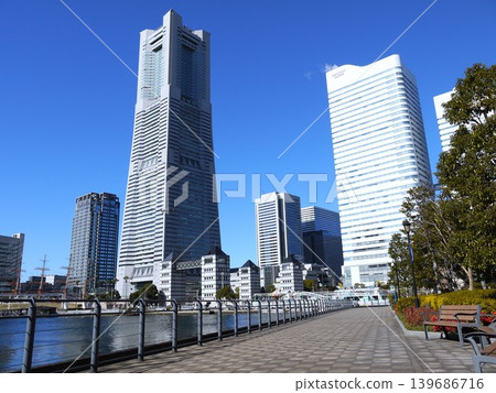 High-rise buildings lined up along a canal High-rise buildings lined up along a canal 139686716
