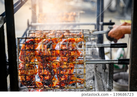 grilled chicken wings and legs on the grill grilled chicken wings and legs on the grill 139686723