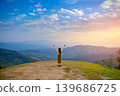 mountains, sunrise, woman, young, happy, scenic, sun, summer, rock, tourist, beautiful, high, mountain, view, fall, freedom, top, man, female, hand, sky, nature, hiking, hike, peak, girl, people, morn 139686725