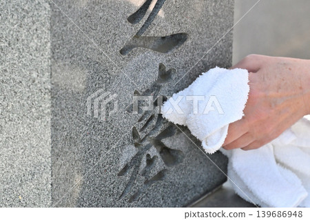 Seniors cleaning graves Seniors cleaning graves 139686948