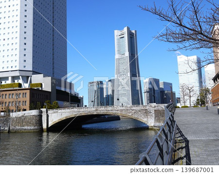High-rise buildings lined up along a canal High-rise buildings lined up along a canal 139687001