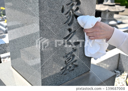 Seniors cleaning graves Seniors cleaning graves 139687008
