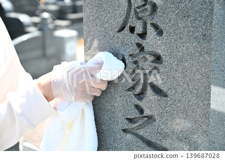Seniors cleaning graves Seniors cleaning graves 139687028