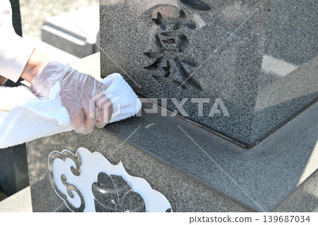 Seniors cleaning graves Seniors cleaning graves 139687034