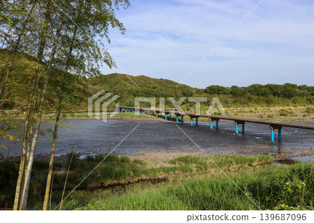 Sada Submersible Bridge and bamboo in Shimanto City, Kochi Prefecture, surrounded by fresh greenery. Sada Submersible Bridge and bamboo in Shimanto City, Kochi Prefecture, surrounded by fresh greenery. 139687096