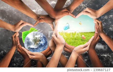 Environmental unity and global earth day and international environment concept with world community as hands protecting nature from pollution and climate change. Symbol and shape created from hands. Environmental unity and global earth day and international environment concept with world community as hands protecting nature from pollution and climate change. Symbol and shape created from hands. 139687127