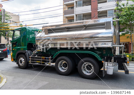 Large tank trucks driving through the city Large tank trucks driving through the city 139687146