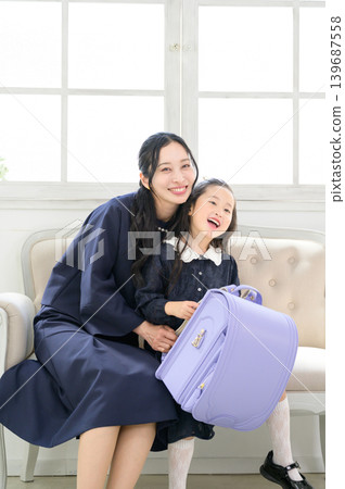 Japanese parent and child carrying school bags Japanese parent and child carrying school bags 139687558