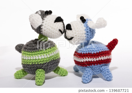 Knitted woolen dogs on a white background 139687721