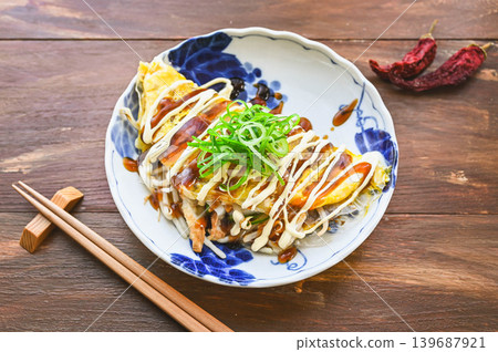 Bean sprout and fish cake wrapped in egg, okonomiyaki style Bean sprout and fish cake wrapped in egg, okonomiyaki style 139687921