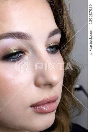 Beauty salon and makeup. Women's Hair Salon. The stylists at the women's salon are working with a young woman. Beauty salon and makeup. Women's Hair Salon. The stylists at the women's salon are working with a young woman. 139687989