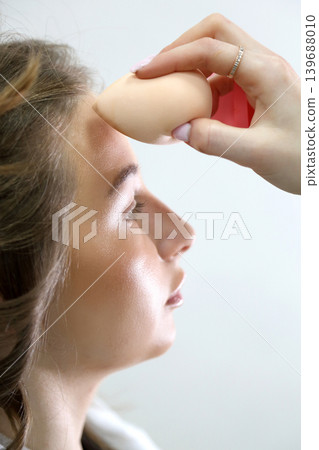 Beauty salon and makeup. Women's Hair Salon. The stylists at the women's salon are working with a young woman. Beauty salon and makeup. Women's Hair Salon. The stylists at the women's salon are working with a young woman. 139688010