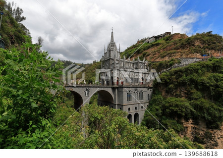 A hidden gem in Colombia, South America: The Las Lajas Church nestled in a valley and surrounded by lush greenery. 139688618