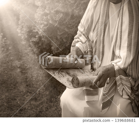 Old man reading the scroll Old man reading the scroll 139688681