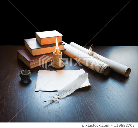 Books and candle on the table Books and candle on the table 139688702