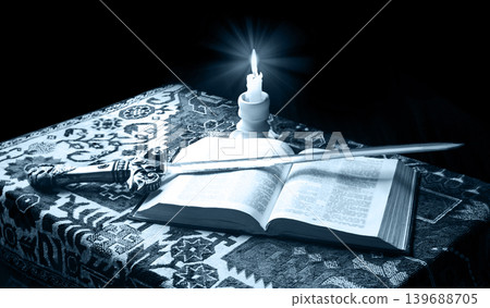 An old sword on the bible An old sword on the bible 139688705