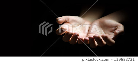 Asking hands on black backdrop Asking hands on black backdrop 139688721