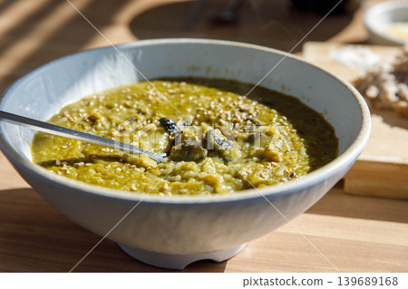 Traditional Jeju Sea Snail Porridge in a Ceramic Bowl Traditional Jeju Sea Snail Porridge in a Ceramic Bowl 139689168