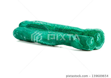 Macro mineral stone malachite stalactite on white background Macro mineral stone malachite stalactite on white background 139689654
