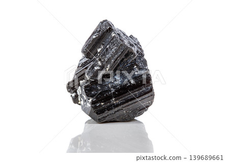 macro mineral stone sherle, schorl, black tourmaline on white background macro mineral stone sherle, schorl, black tourmaline on white background 139689661