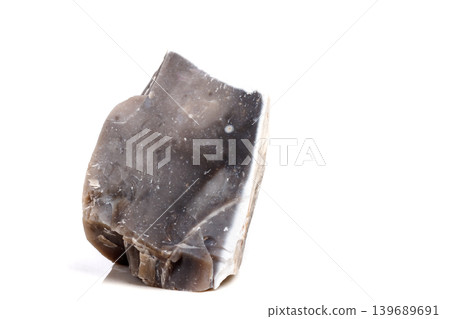Macro mineral stone Flint in the rock on a white background Macro mineral stone Flint in the rock on a white background 139689691