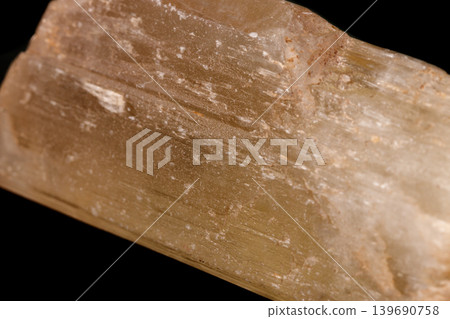 Macro mineral stone Spodumene on a black background Macro mineral stone Spodumene on a black background 139690758