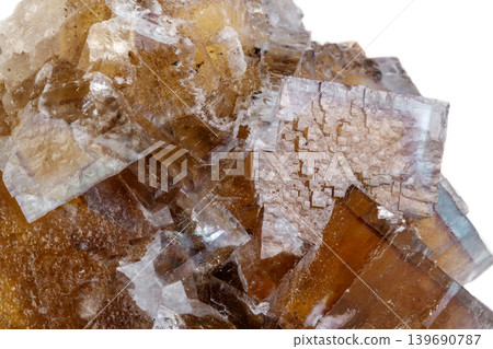 Macro mineral stone yellow Fluorite on a white background Macro mineral stone yellow Fluorite on a white background 139690787