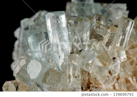 Macro mineral stone crystals Aquamarine in rock on a black background Macro mineral stone crystals Aquamarine in rock on a black background 139690791