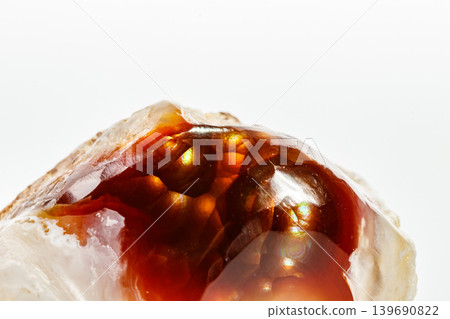 Macro mineral stone fiery Agate on a white background Macro mineral stone fiery Agate on a white background 139690822