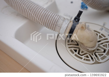 Washing machine drain (before cleaning) Washing machine drain (before cleaning) 139691922