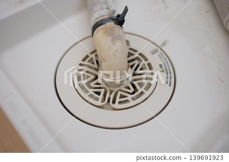 Washing machine drain (before cleaning) Washing machine drain (before cleaning) 139691923