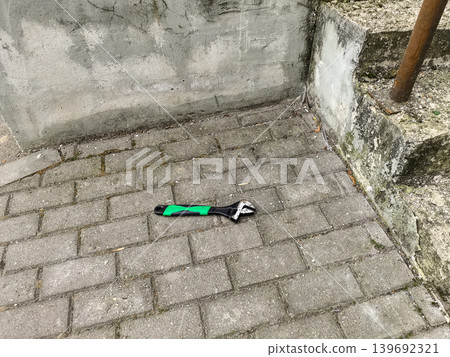 Adjustable Wrench on Paving Stones Adjustable Wrench on Paving Stones 139692321