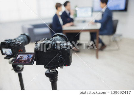 Shooting videos in the office Shooting videos in the office 139692417