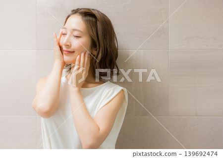 Young woman looking at a mirror 139692474