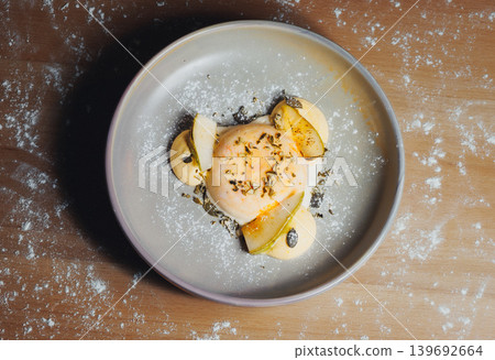 Egg dish on plate with herbs and potato garnish Egg dish on plate with herbs and potato garnish 139692664